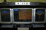 Eclipse 500 panel, May 2002.  New industrial design and other improvements to be introduced Spring and Summer of 2002.<br><br>Autopilot controls are top and center, above the MFD, and include speed settings for auto-throttles, as well as the usual 2D and 3D modes.  The guarded annunciator/switches either side of the autopilot controls are engine fire detection and fuel shut-off.  <br><br>Note backup attitude indicator, engine instruments, messages and checklists on MFD.  The six circuit breakers below the lighting controls are the only physical CBs in the plane.  The rest are all electronic CBs, controlled by the FMS.  