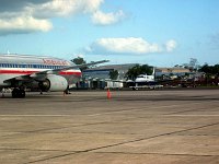 N898WW on the ramp at Belize International, as seen from the window of our chartered Cessna 207 as we taxi out for departure to Placencia.  <br>