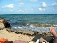 Our villa at Turtle in is RIGHT on the beach, with the waves only steps away.  This is Doug's view from his chaise lounge right in front of the villa.  