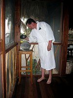 John inspects the vase in our villa at Turtle Inn.  