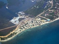 Looking back on Turtle Inn as we depart in &quotSofia.&quot  The Inn is the collection of thatched buildings, with the circular swimming pool in the middle.  
