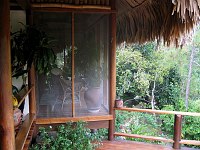 Looking from the dining table in the Coppola villa towards one of the screened porches off the bedroom.  