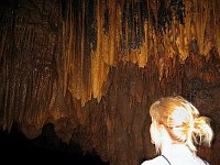 Geologist Margaret observes the cave stalactites.  
