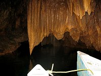 Here, one stalactite is almost touching the water, stopping its growth.  