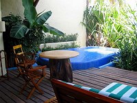 Double-wide chaise lounge, table for breakfast and a private pool all make the patio off the suite the place to be.  